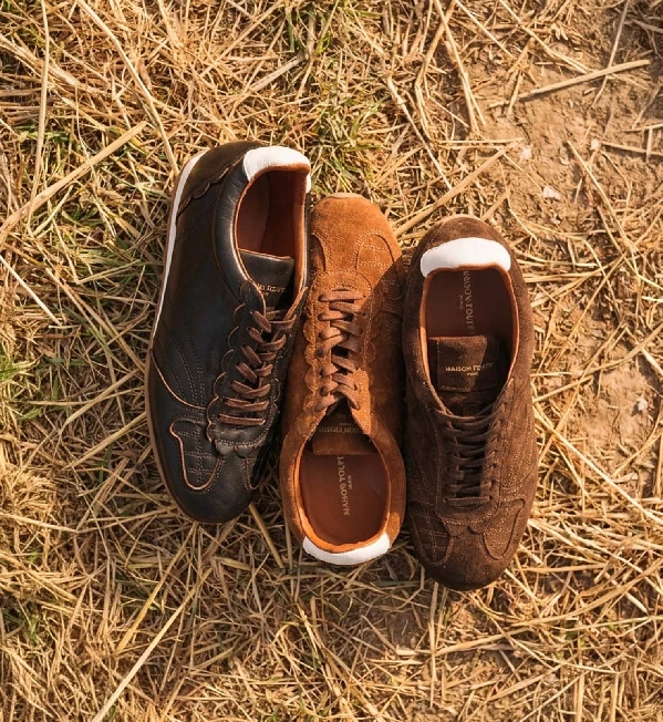 Maison Toufet laced boots photographed on rock outdoors