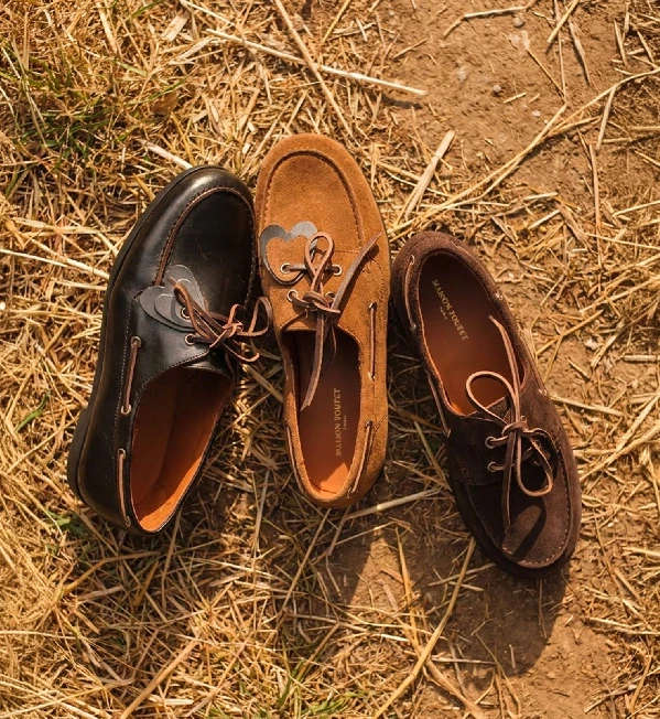 Maison Toufet camel loafers worn with brown pants on balcony